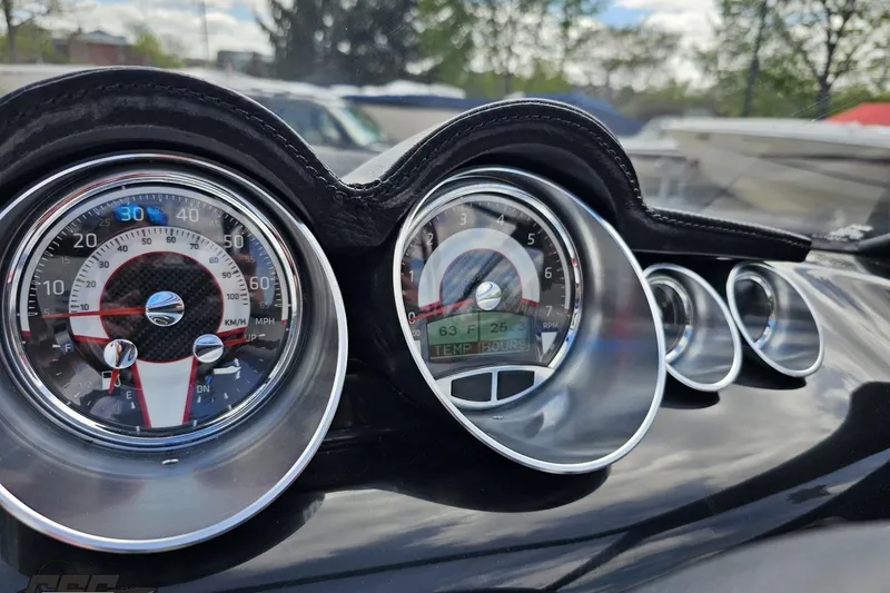 Slide: The Image of Dashboard of a 2020 Glastron GTS 225 boat with speedometer and gauges. - 66