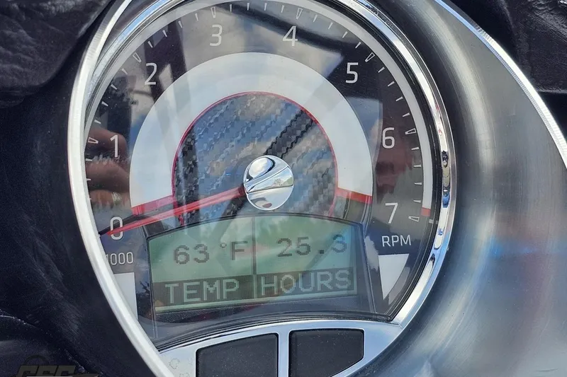 Slide: The Image of Close-up of 2020 Glastron GTS 225 speedometer showing 63°F and 25.3 hours. - 67
