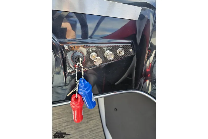 Slide: The Image of Control panel of a 2020 Glastron GTS 225 boat with ignition keys. - 68