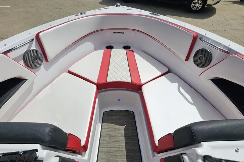 Slide: The Image of 2020 Glastron GTS 225 boat interior with red and white seating, featuring speakers. - 73