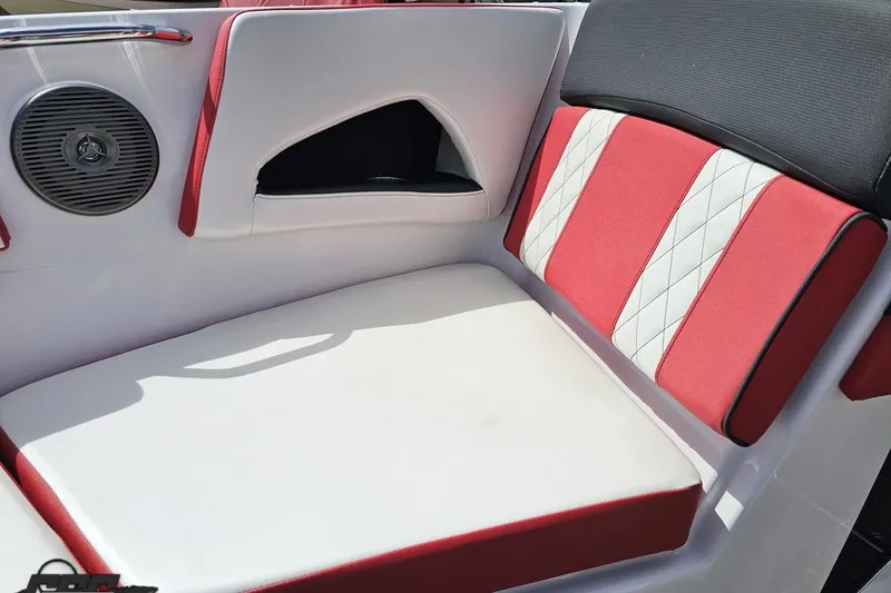 Slide: The Image of 2020 Glastron GTS 225 boat interior with red and white seating and speaker. - 76