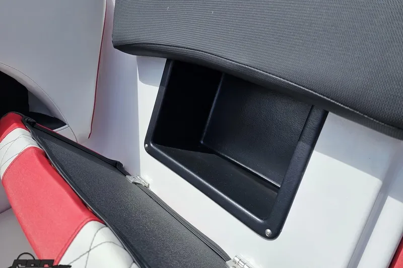 Slide: The Image of 2020 Glastron GTS 225 boat interior storage compartment with red and white seating. - 77