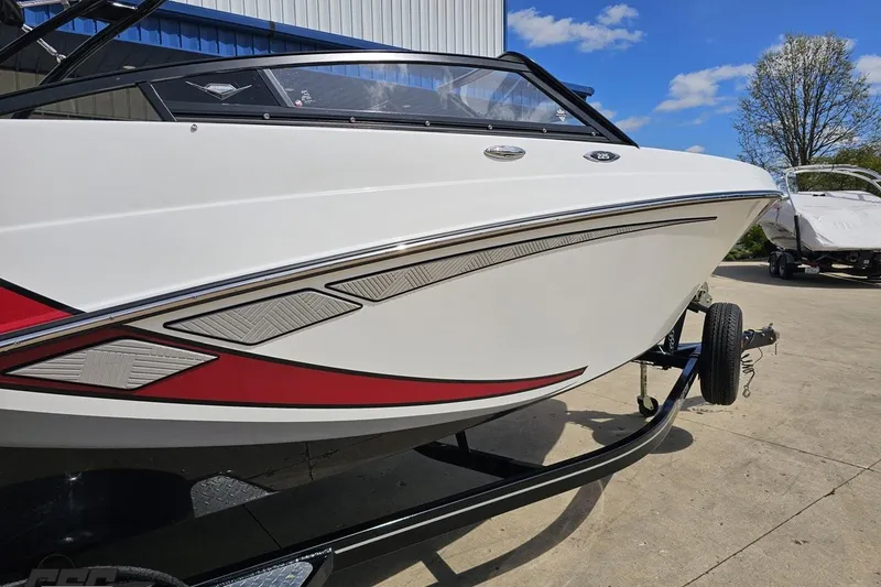 Slide: The Image of 2020 Glastron GTS 225 boat on trailer, featuring sleek white and red design. - 8
