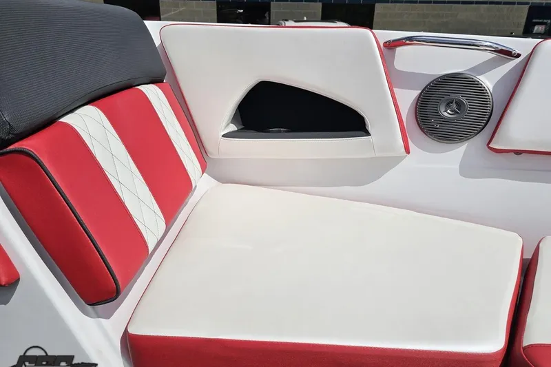 Slide: The Image of 2020 Glastron GTS 225 boat interior with red and white seating and speaker. - 80