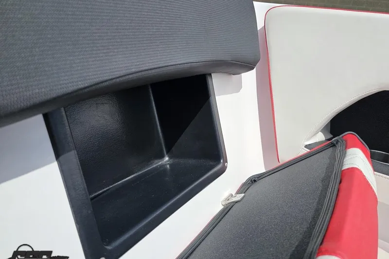 Slide: The Image of 2020 Glastron GTS 225 boat interior storage compartment with red and white seating. - 81