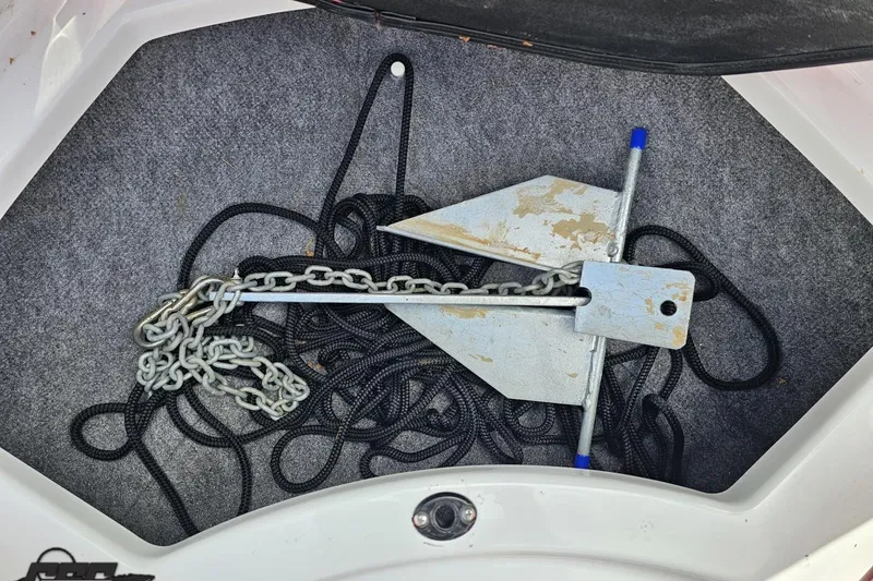 Slide: The Image of Anchor and chain in a 2020 Glastron GTS 225 boat compartment. - 84