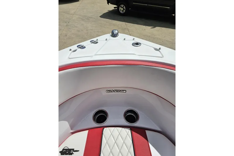 Slide: The Image of 2020 Glastron GTS 225 boat interior with red and white seating, showcasing brand logo. - 85