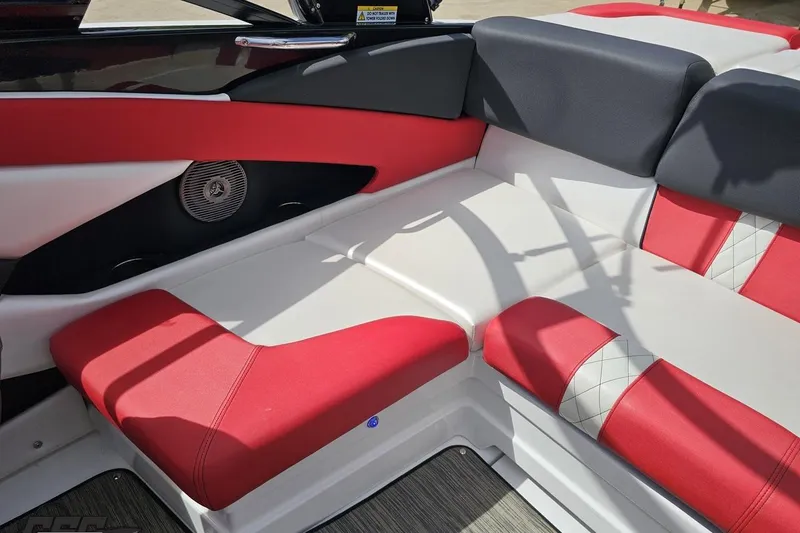Slide: The Image of 2020 Glastron GTS 225 boat interior with red and white seating, featuring stylish design. - 90