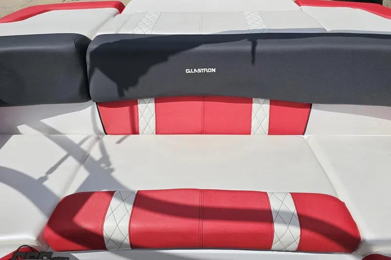 Slide: The Image of 2020 Glastron GTS 225 boat interior with red and white upholstery. - 93