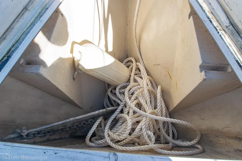 Slide: The Image of Anchor locker of 1987 Catalina 36 sailboat with rope and fender. - 37