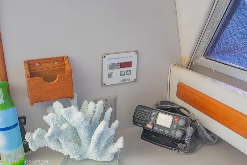 Slide: The Image of Interior of 1991 Sea Ray 370 Sedan Bridge with control panel and marine radio. - 15