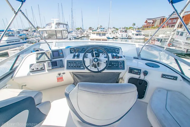 Slide: The Image of Cockpit view of 1991 Sea Ray 370 Sedan Bridge yacht in marina. - 26