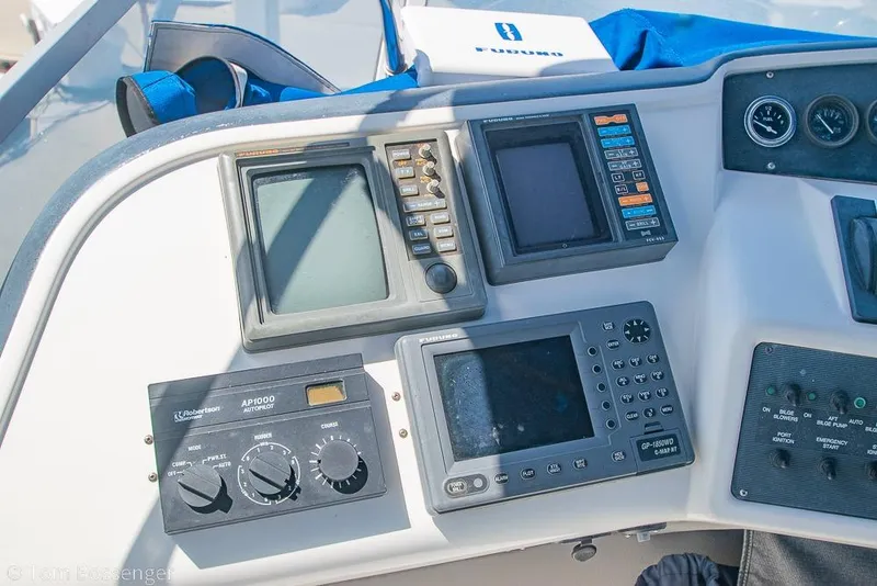 Slide: The Image of Control panel of a 1991 Sea Ray 370 Sedan Bridge with navigation instruments. - 28