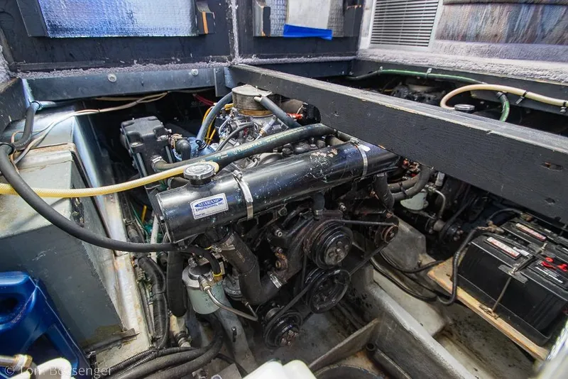 Slide: The Image of Engine compartment of a 1991 Sea Ray 370 Sedan Bridge boat, showcasing mechanical components. - 36
