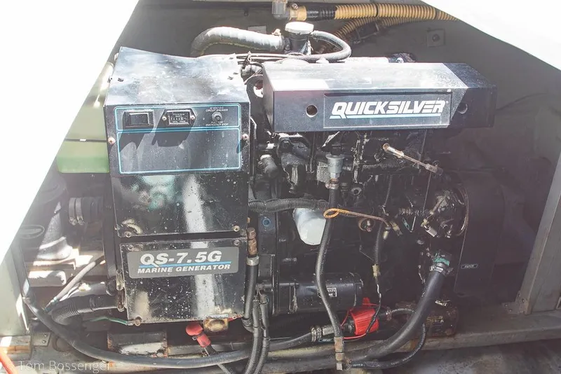 Slide: The Image of Marine generator in a 1991 Sea Ray 370 Sedan Bridge engine compartment. - 38