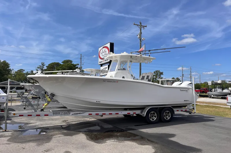 The Image of 2019 Tidewater 280 CC Adventure boat on trailer under clear blue sky. - 0