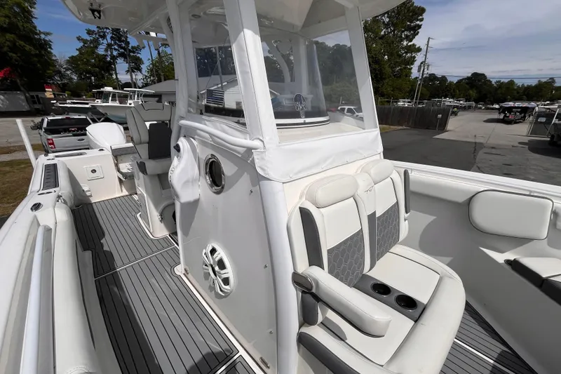 Slide: The Image of 2019 Tidewater 280 CC Adventure boat interior with seating and helm station. - 15