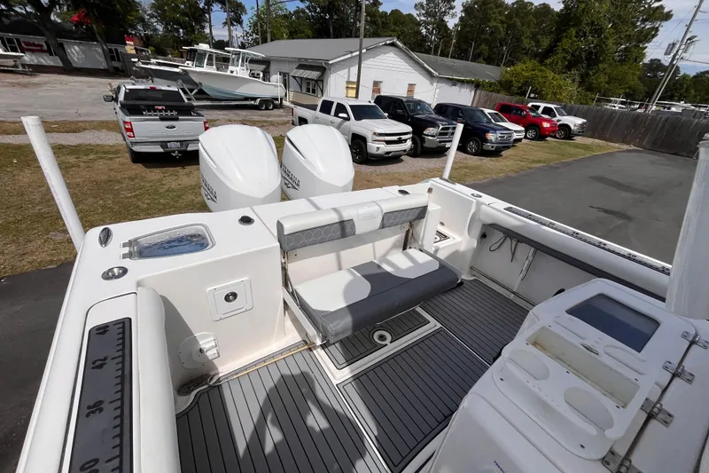 Slide: The Image of 2019 Tidewater 280 CC Adventure boat with dual engines and spacious deck layout. - 17