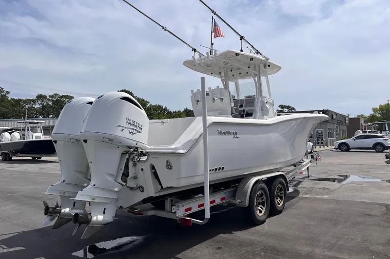 Slide: The Image of 2019 Tidewater 280 CC Adventure boat on trailer with twin Yamaha engines. - 4