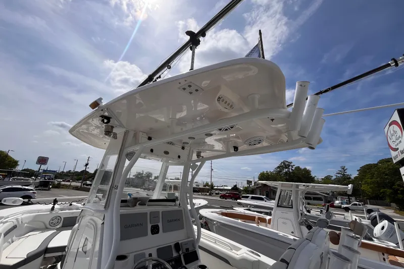 Slide: The Image of 2019 Tidewater 280 CC Adventure boat with advanced Garmin navigation system under a clear sky. - 9