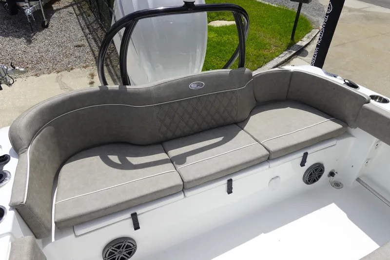 Slide: The Image of 2026 Sea Hunt Ultra 245 SE boat with cushioned seating and modern design. - 10