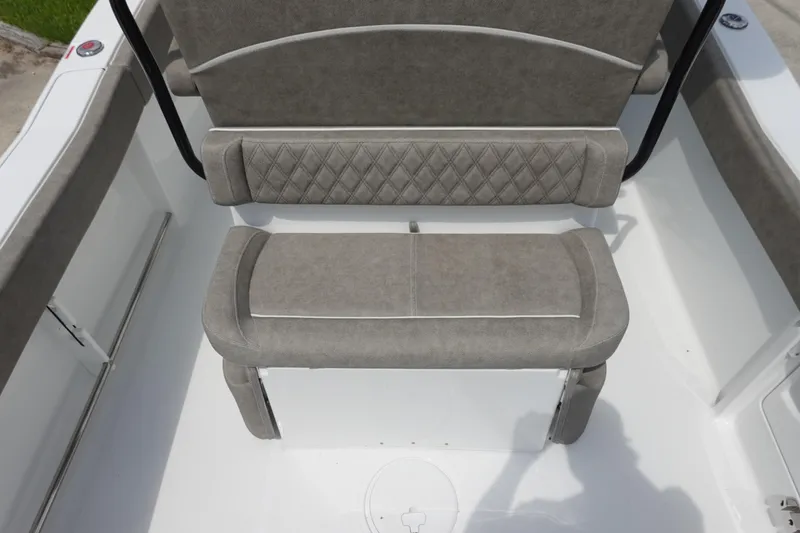 Slide: The Image of 2026 Sea Hunt Ultra 245 SE boat seating with cushioned backrest and diamond-patterned upholstery. - 16