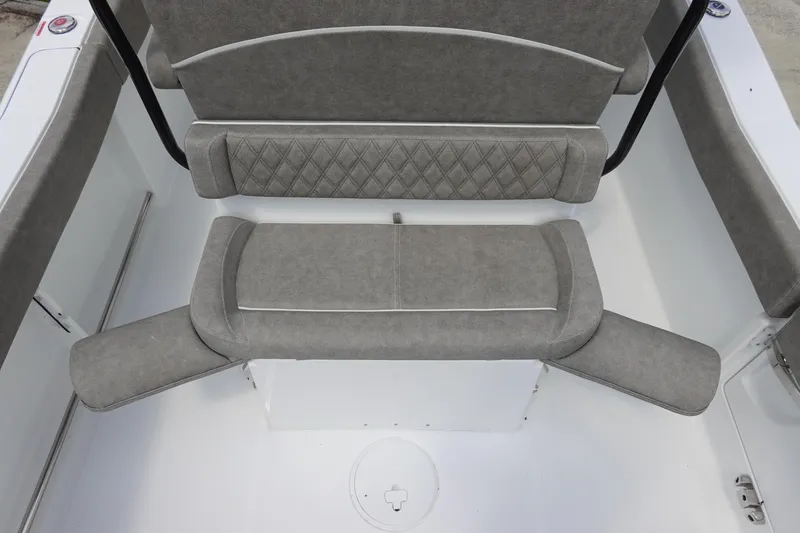 Slide: The Image of 2026 Sea Hunt Ultra 245 SE boat seating with gray upholstery and diamond pattern design. - 17