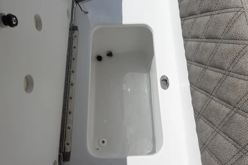 Slide: The Image of Interior view of 2026 Sea Hunt Ultra 245 SE boat compartment and seating. - 18