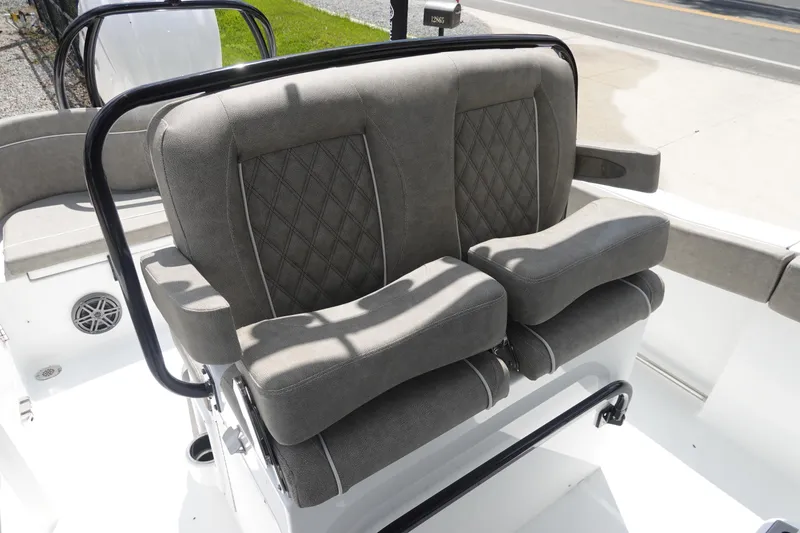 Slide: The Image of 2026 Sea Hunt Ultra 245 SE boat seating with cushioned armrests and diamond-pattern upholstery. - 20