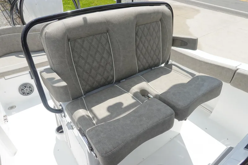 Slide: The Image of 2026 Sea Hunt Ultra 245 SE boat seating with diamond-stitched upholstery and sleek design. - 21