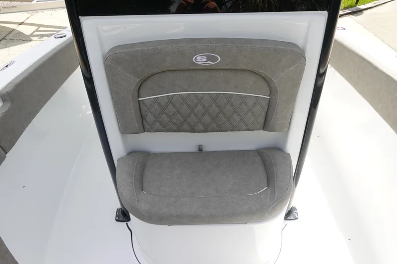 Slide: The Image of 2026 Sea Hunt Ultra 245 SE boat seat with gray upholstery and diamond pattern design. - 26