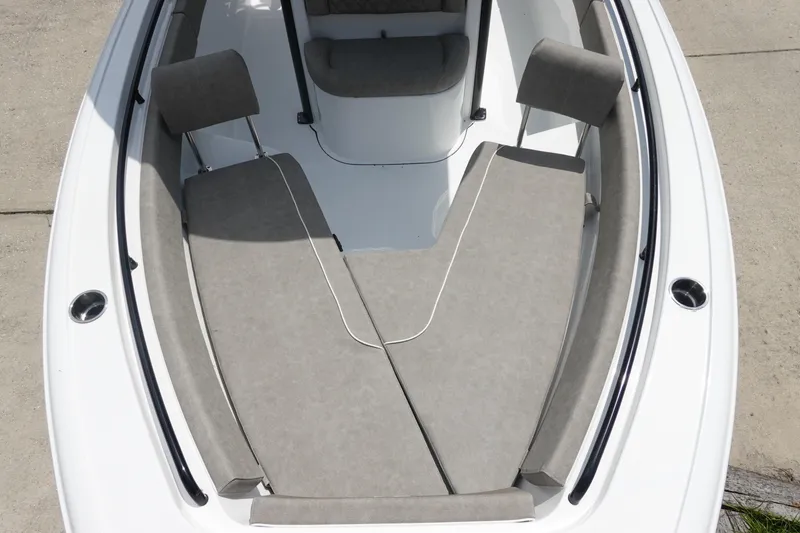 Slide: The Image of 2026 Sea Hunt Ultra 245 SE boat interior with cushioned seating and sleek design. - 30