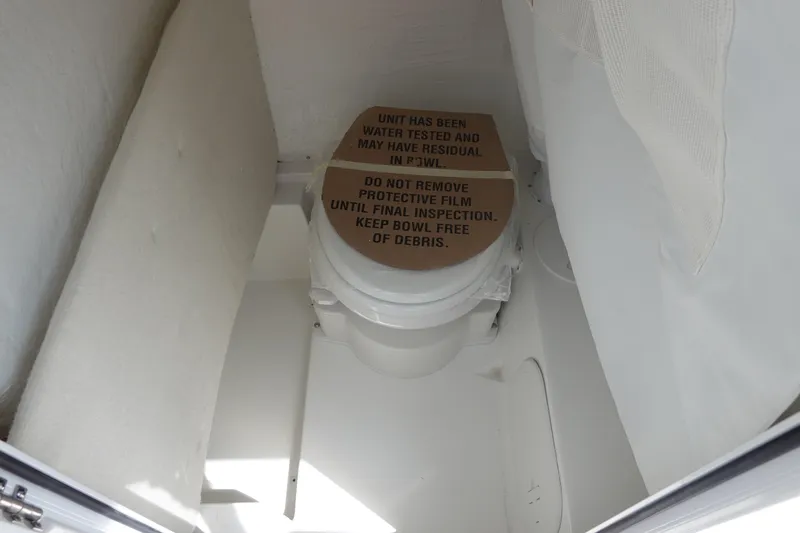 Slide: The Image of Toilet in Sea Hunt Ultra 245 SE boat, 2026 model. - 37