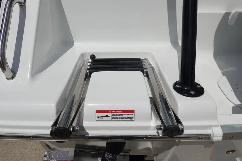 Slide: The Image of 2026 Sea Hunt Ultra 245 SE boat ladder and safety warning label. - 8