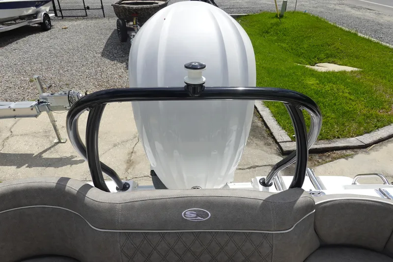 Slide: The Image of 2026 Sea Hunt Ultra 245 SE boat, rear view with engine and seating area. - 9