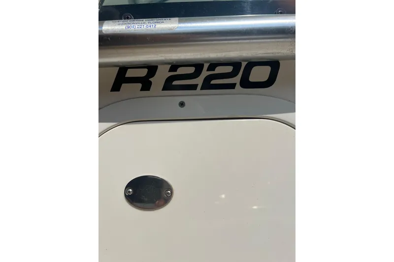 Slide: The Image of 2005 Robalo R220 Center Console boat detail with model number visible. - 4