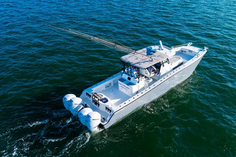 Slide: The Image of Aerial view of 2022 Freeman 42LR boat cruising on open water. - 16
