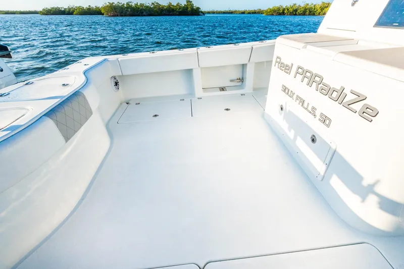 Slide: The Image of Spacious deck of 2022 Freeman 42LR boat on calm waters. - 21