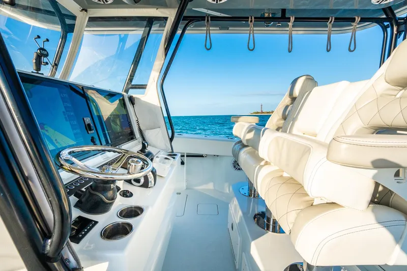Slide: The Image of Interior of 2022 Freeman 42LR boat with modern helm and ocean view. - 25