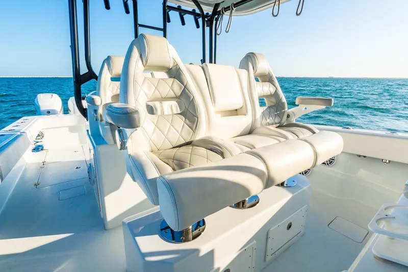 Slide: The Image of Luxurious seating on a 2022 Freeman 42LR boat, overlooking the ocean. - 34