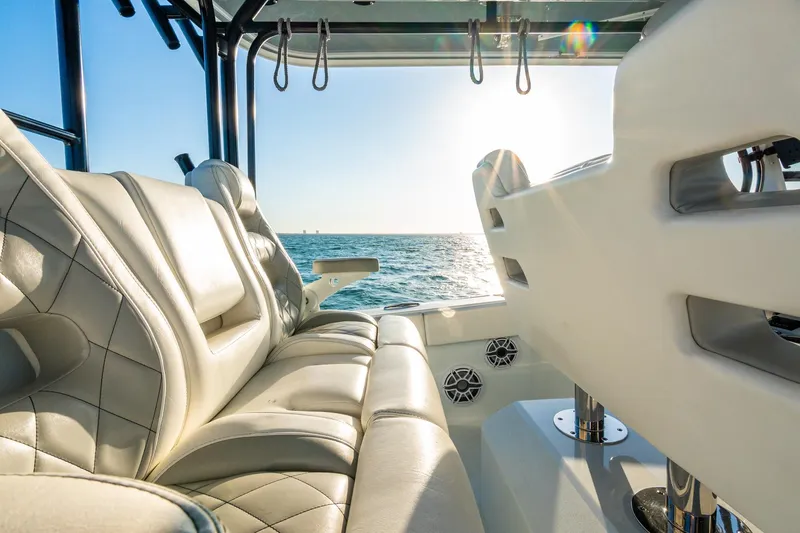 Slide: The Image of Luxurious seating on a 2022 Freeman 42LR boat, ocean view in sunlight. - 36