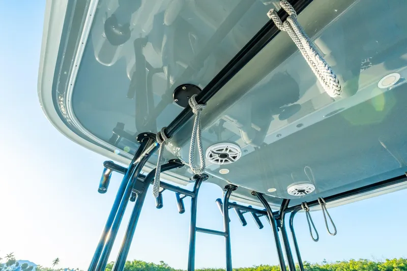 Slide: The Image of Freeman 42LR 2022 boat canopy with ropes and speakers, sunny day. - 38