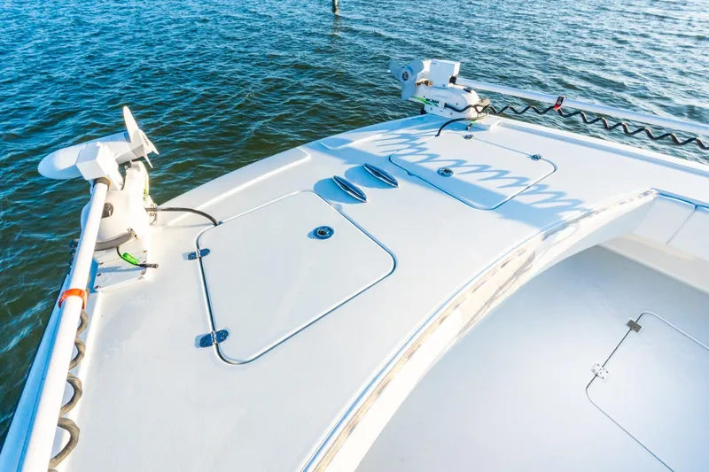 Slide: The Image of Bow of 2022 Freeman 42LR boat on water, featuring fishing equipment. - 50