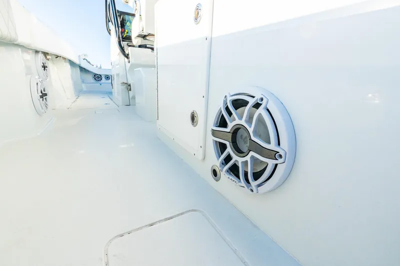 Slide: The Image of Freeman 42LR 2022 boat interior with marine speakers and sleek white design. - 55