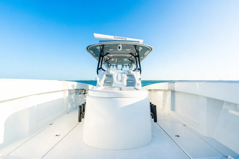 Slide: The Image of 2022 Freeman 42LR boat on open water under clear blue sky. - 58