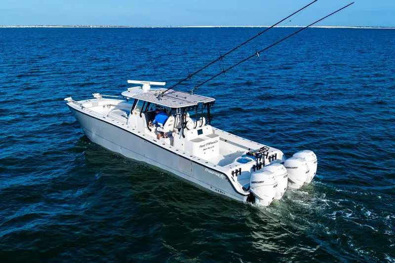 Slide: The Image of Freeman 42LR 2022 boat cruising on open water with fishing rods. - 6