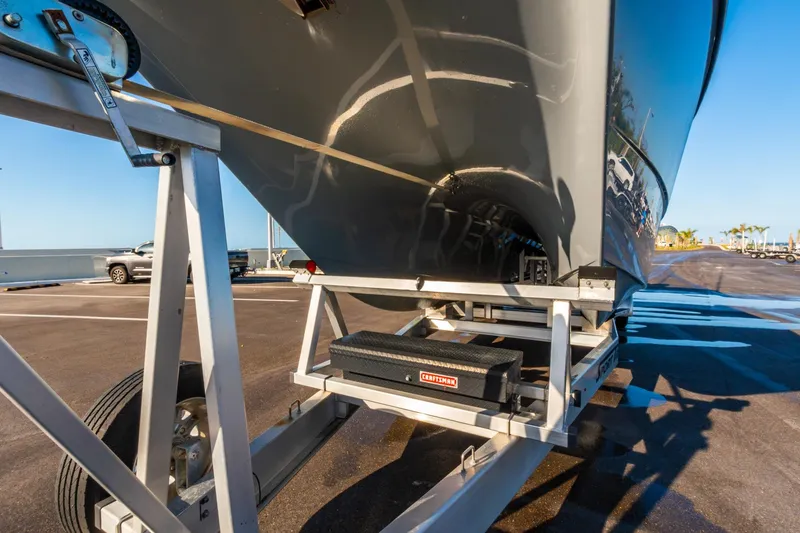Slide: The Image of Freeman 42LR 2022 boat on trailer, Craftsman toolbox visible, sunny day. - 72