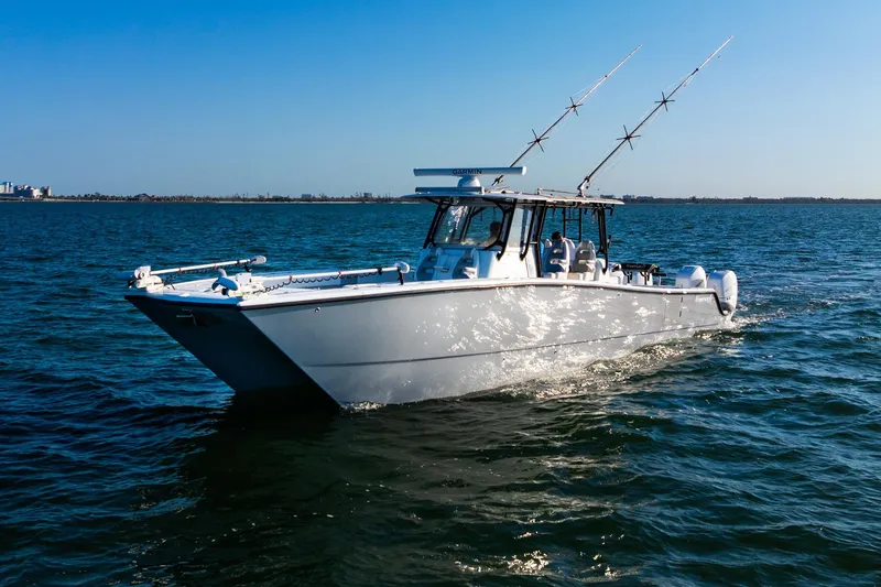 Slide: The Image of Freeman 42LR 2022 boat cruising on open water under clear blue sky. - 9
