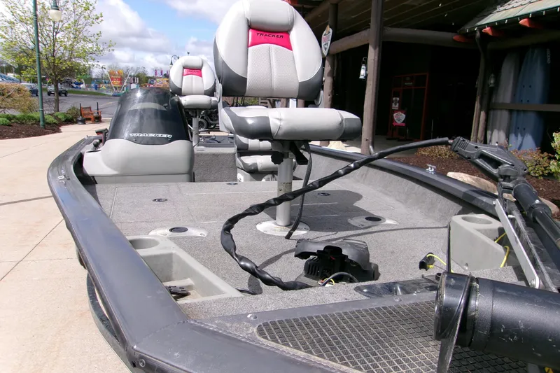 The Image of 2015 Bass Tracker Pro 17 fishing boat with seating and equipment on deck. - 1