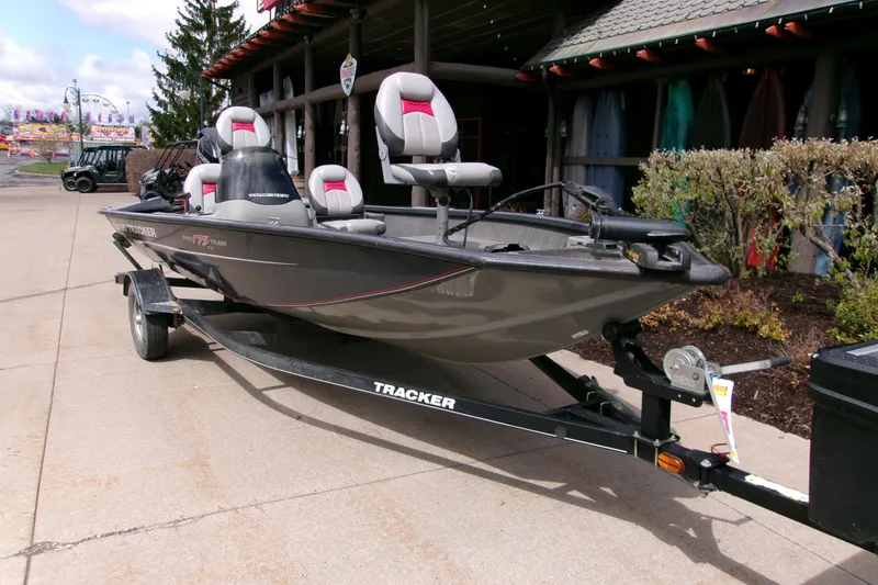 Slide: The Image of 2015 Bass Tracker Pro 17 fishing boat on trailer, parked outdoors. - 3